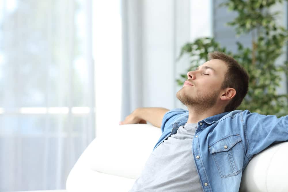 Image of man enjoying fresh air in his home.