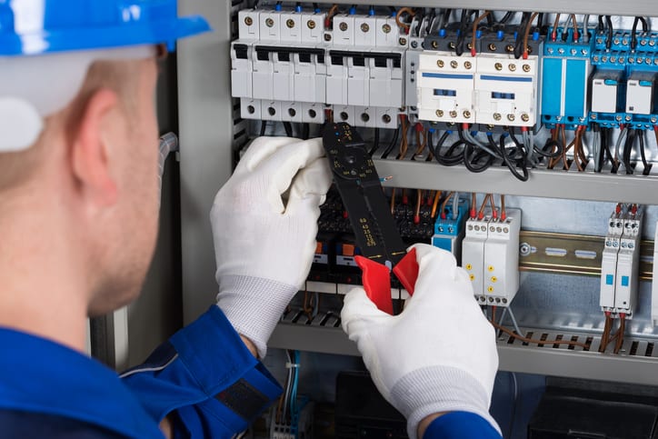 Male Electrician Repairing Fusebox