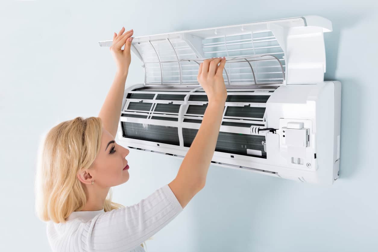 Woman Drying the ac unit.