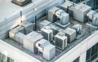 Commercial air conditioning units located on the rooftop of a building.