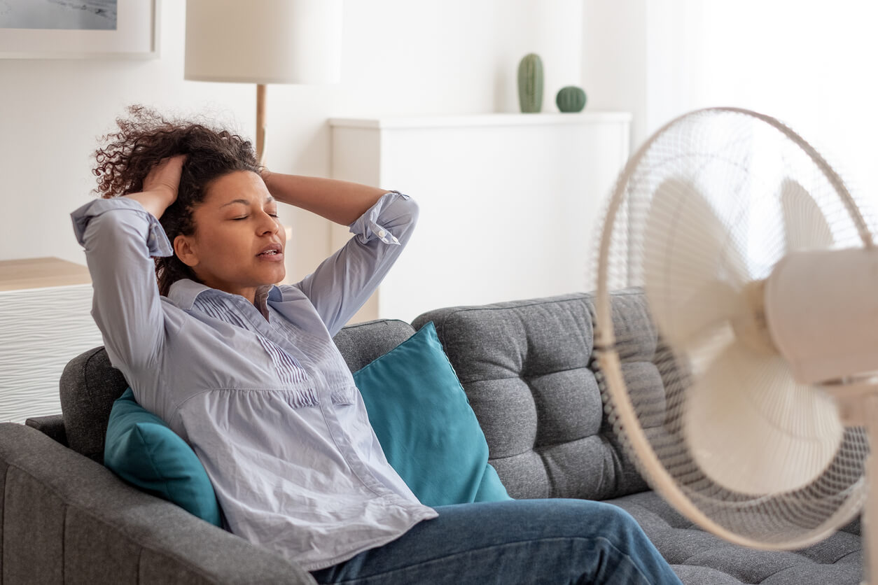 Black Woman at Home Refreshing During Summer Haze