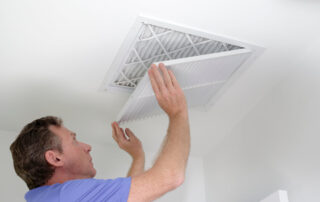 Man Shutting Grill of Hvac, Heating Ventilating and Cooling After Replacing the Air Filter.